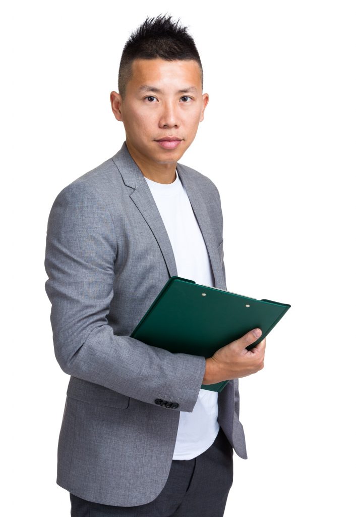 Asian manager holding clipboard